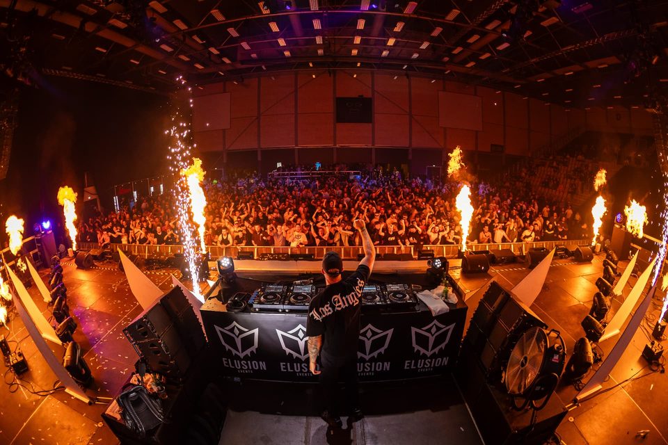 Main stage in full flames with the crowd raising their hands